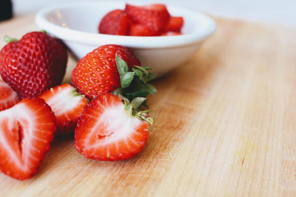 photo of strawberries in bowl on table